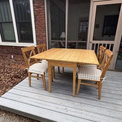 IKEA pine drop leaf table and six ikea chairs with cushions