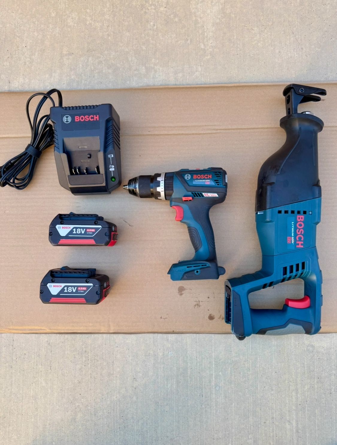 Bosch 18V Hammer drill and Reciprocating Saw with two 4.0 Ah batteries and a charger