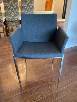 4 gray upholstered arm chairs with chrome  legs