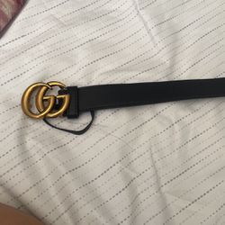 Gold and black gucci belt