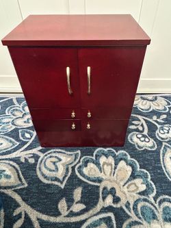 Expanding Makeup Organization Armoire with Gold Hardware