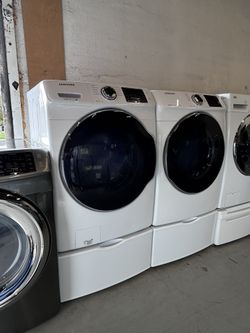 Samsung Front Load Washer and Dryer Set with Pedestals 