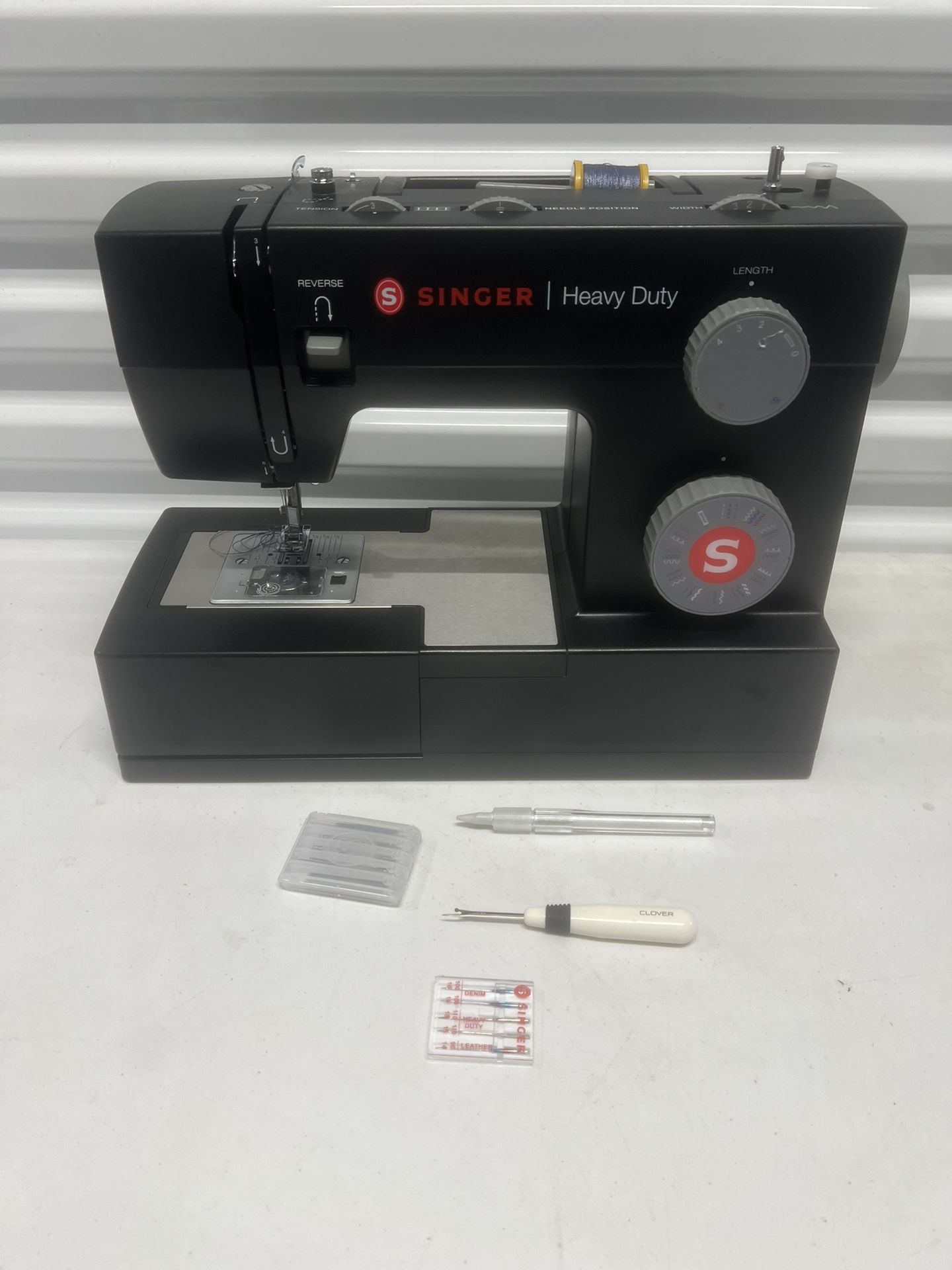 Singer Heavy Duty 4432 Sewing Machine Works Great Condition. No Cord or foot pedal. Tested works however the power supply was shipped with a differen
