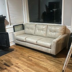 Cream, leather loveseat, and couch