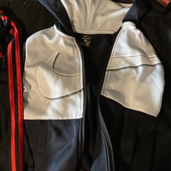4 Track Suits 2 Nike 1 Adidas 1 Puma
