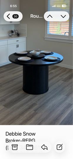 Round  47”  black table with removable lazy susan in the middle. Never use d and only on display while listing a house . Partially  disassembled.