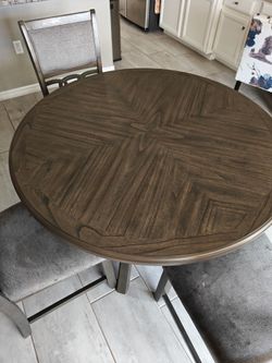 Round Wood Dining Table with Geometric Top