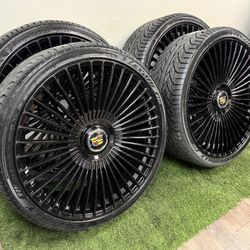 New 26 inch gloss black wheels with cadillac floating caps and Lexani  305/30r26 tires