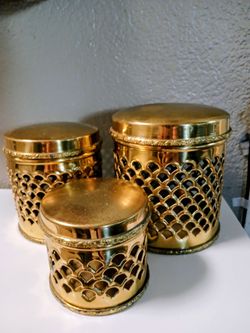 Vintage Regency pierced brass canister set