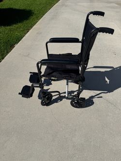 Black Transport Wheelchair with Footrests