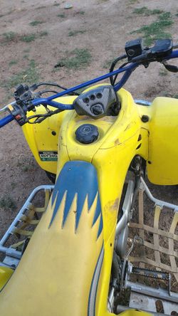 Yellow ATV Four Wheeler with Blue Handlebars ltz 400