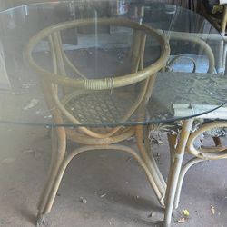 RATTAN GLASS TOP TABLE AND FOUR CHAIRS