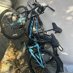 2 huffy bikes the black and blue is a trail runner