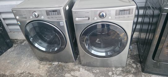 Front-loading washer and dryer set. Working perfectly.