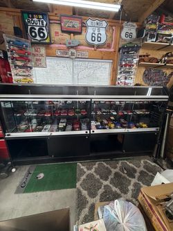 Glass display case $550.00 or best offer cars are not included