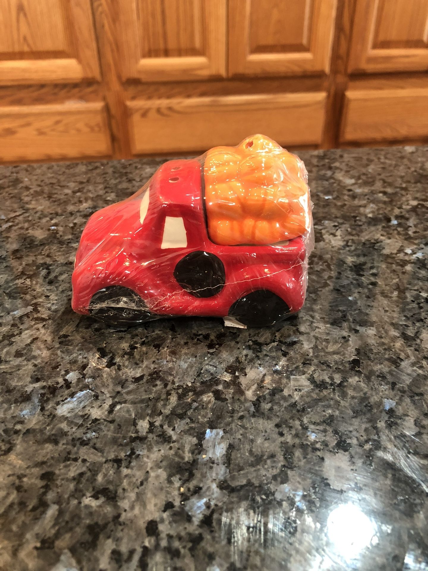 Red Truck Pair Of Salt And Pepper Shakers .  Size 2 1/2 inches Tall And 4 inches Long.  Brand New Never Opened Factory Sealed 