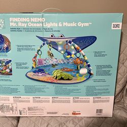Brand new Bright Starts Disney Baby Finding Nemo Mr. Ray Ocean Lights & Music Gym for Ages Newborn and up. Box  unsealed but nothing was taken out or 