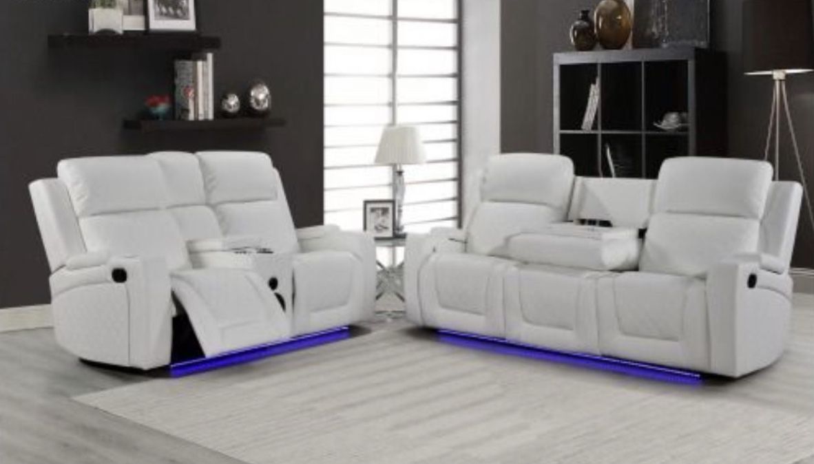 Reclining sofa and loveseat with Bluetooth speakers and LED lighting