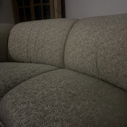 Mid-Century to Modern cloud curved sofa features a palm leaf pattern texture and plush, rounded arms