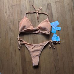 Brand new two-piece ROXY bikini. Tags still on. The top is an XL and the bottom is a L