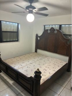 Traditional-style dark wood bed frame