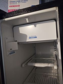 Refrigerator with In-Door Ice Maker