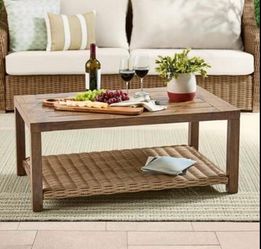 Outdoor/Indoor coffee table. Faux anti rust wood and wicker