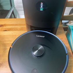 Laresar Clean robot vacuum and mop combo in black. It features 3-in-1 functionality: sweeping, vacuuming, and mopping.  The system includes a self-emp