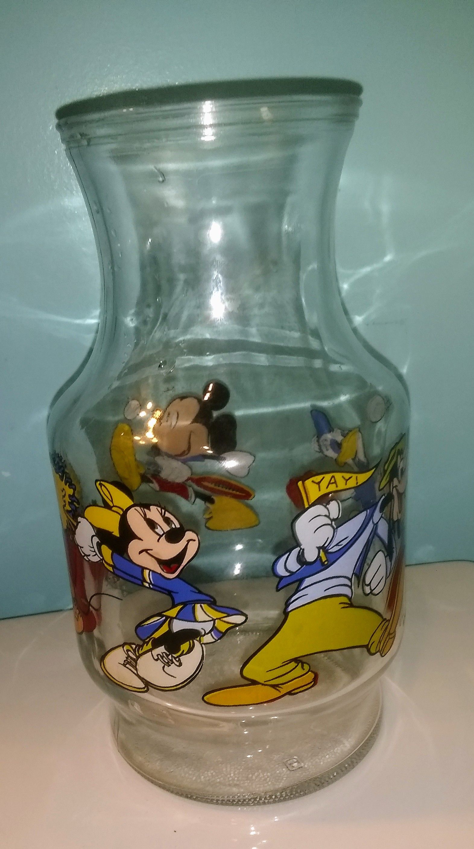 Walt disney glass juice jar and mickey mouse picture