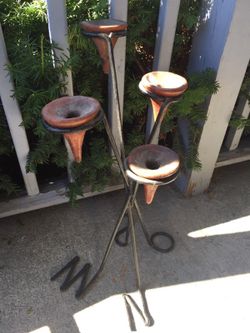 Iron and clay antique candle holder from Maine