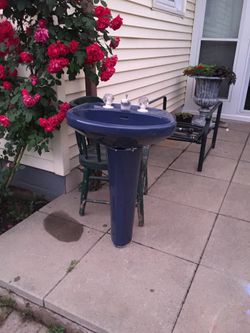 Blue sink and pedestal