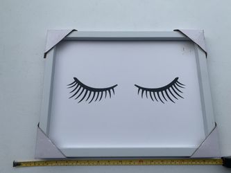 Framed wall art with eyelash design. Pick up Coral Springs 33071