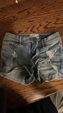 light blue jeans with two cut light blue jean shorts with two cut