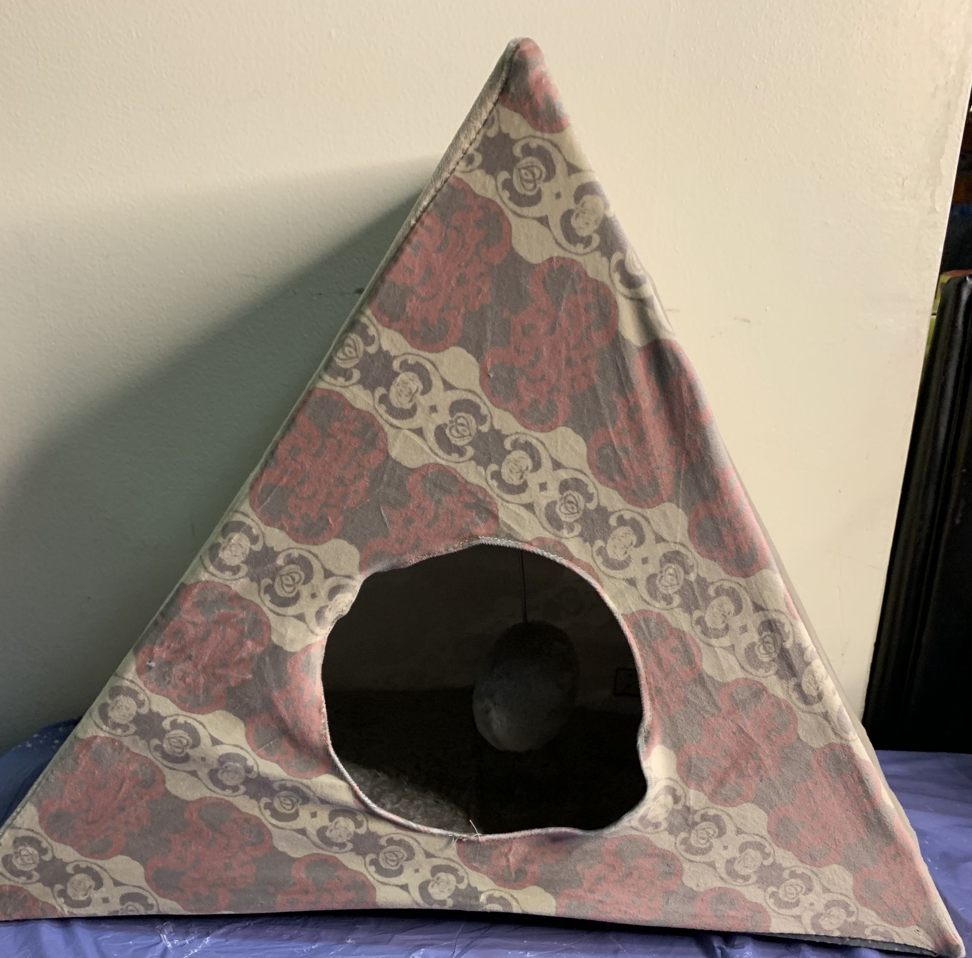 Kong fold up teepee cat tent with ball toy inside and nail scratcher on the side