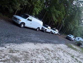 White Ford Cargo Van with Roof Rack