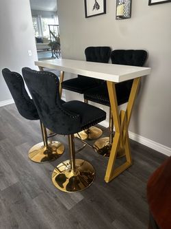 Bar top table and chairs