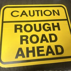 Caution Rough Road Ahead Sign