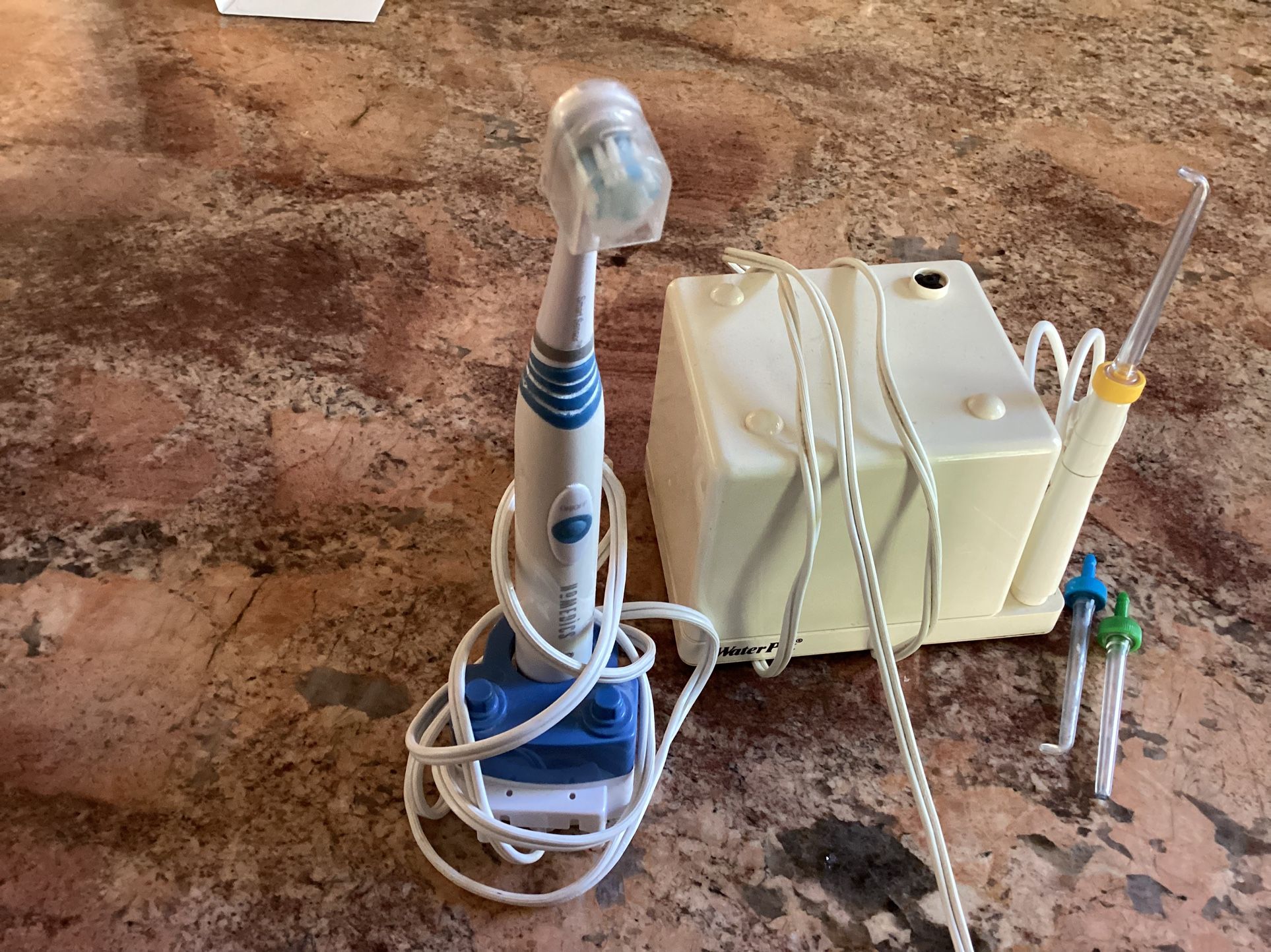 Toothbrush And Water Pike