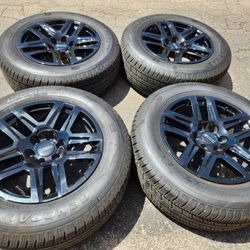 20" Chevy gmc sierra black factory wheels and tires 