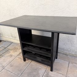 46.5in W x 31.5in D - Bar table with wine rack