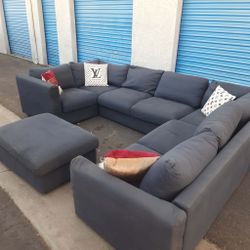 Beautiful sectional couch gray with ottoman,
