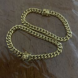 2 small cuban links bracelets