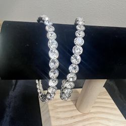 2 crystal rhinestone silver tone bangle bracelets, with excellent sparkle. 