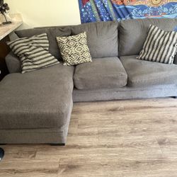 Sofa With Reversible Chaise And Pillows