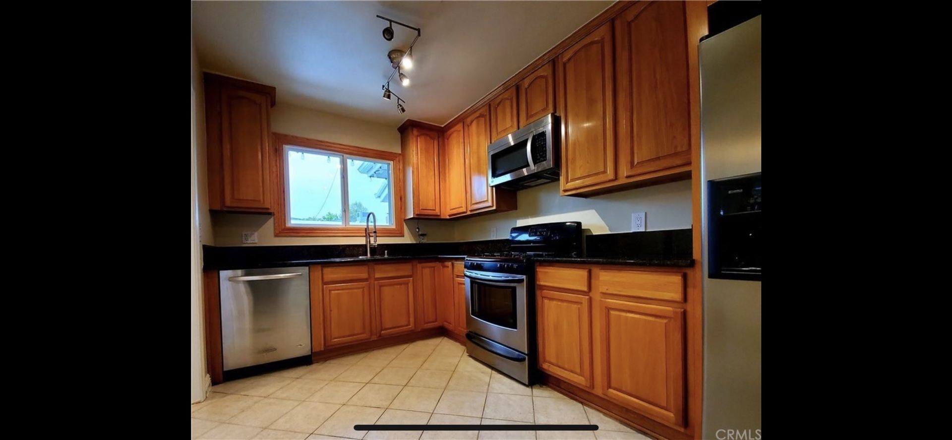 kitchen cabinets Counter tops Stove and Microwave