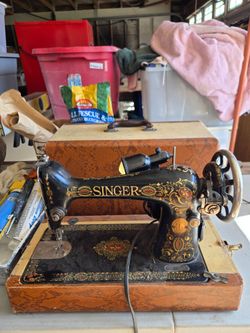 Singer red eye sewing machine in case
