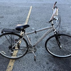 Norco Malahat hybrid comfort bicycle in silver with a rear rack