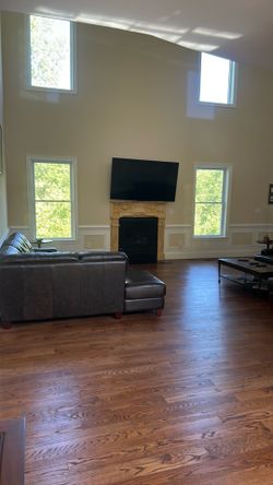 Bassett Leather Double Sectional Sofa  with Ottoman, 2  Bassett end tables and Bassett coffee table
