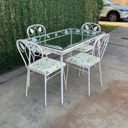 Wrought iron  patio table with 4 chairs