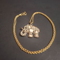Bedazzled Goldtonr Elephant Pendant On A 33" Twisted Rope Goldtone Chain, Embellished W/Clear Crystals & Iridescent Ivory Colored Cabochons